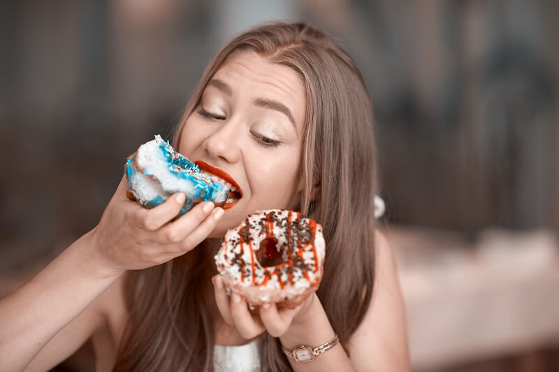 lady eating donuts